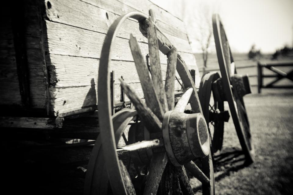 Black and white photo of an old wagon wheel